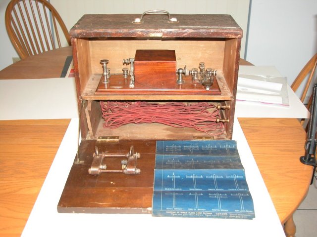 The box with front desk open.  Box relay in upper compartment, wiring for attaching to telegraph lines in bottom compartment.
